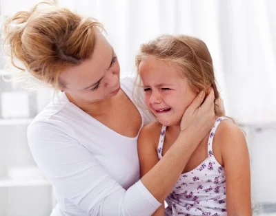 mother comforting crying child